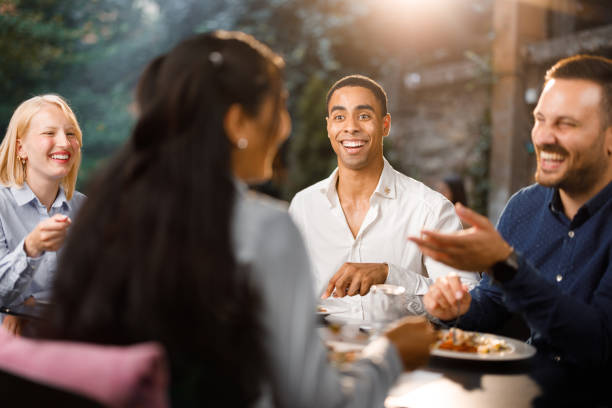 istock Happy entrepreneurs talking while enjoying in lunch at a restaurant. 2137322331