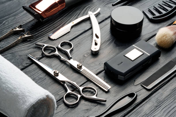istock Professional Barber Tools Laid Out on Dark Wooden Surface 2137335520