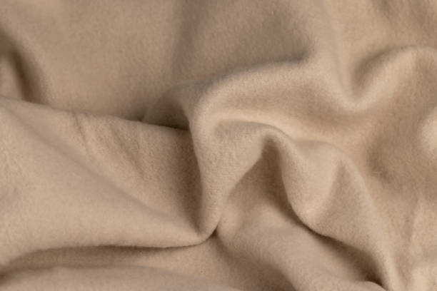istock beige soft cotton fabric for sewing clothes 2137341054