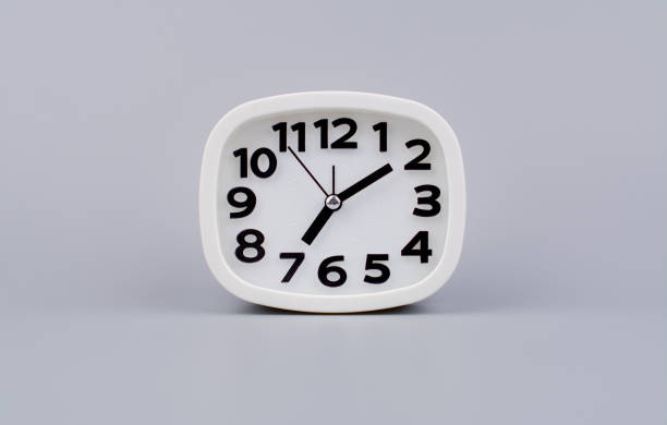 istock Modern alarm clock ticking, standing still time, time concept, time photography in studio. 2137353410