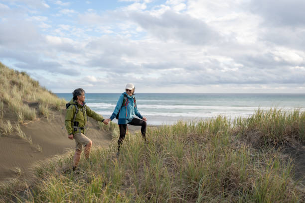 istock Mature Couple Holding Hands on Walk 2137363580