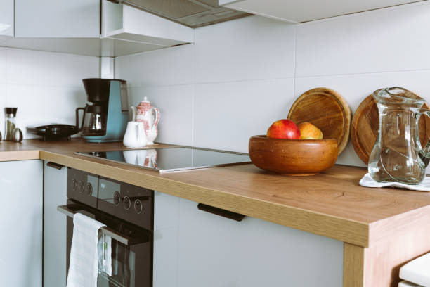 istock Interior modern kitchen with built-in appliances, wooden countertop 2137363604