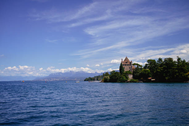 Picturesque Yvoire, the most flower-adorned village in France, showcasing its historic castle from the shimmering waters.