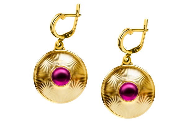 Vintage large golden earrings with pink gems isolated on white background