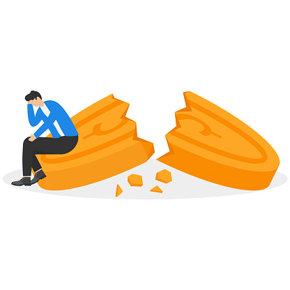 A businessman sitting on a broken coin. Financial Crisis