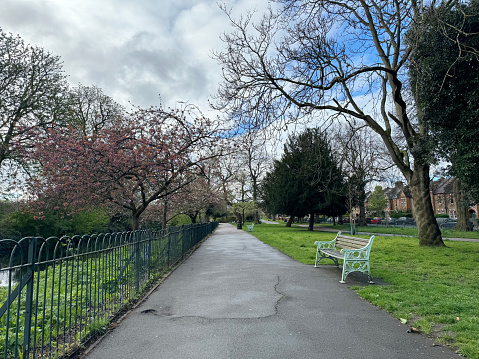 Foot path and bench in Lloyd Park, in Walthamstow, east London