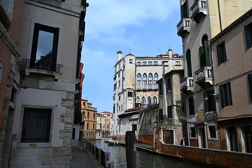 Venice canal lined with houses and palace
