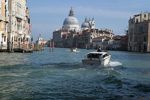 Taxi boat on the Grand Canal with the Basilica of Santa Maria della Salute in the background
