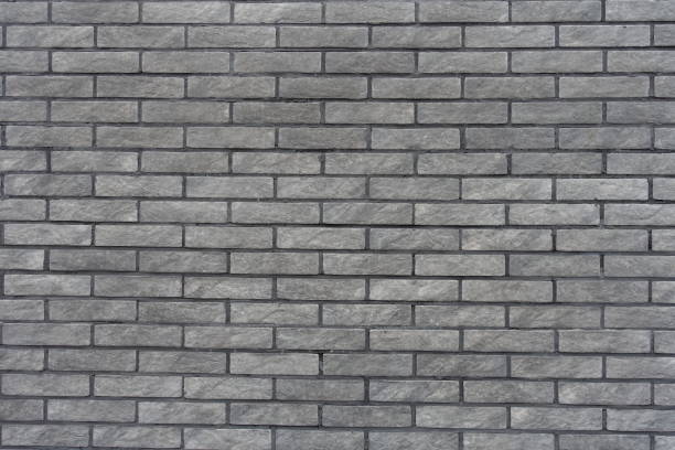 istock Background - gray artificially aged brick veneer wall 2137459383