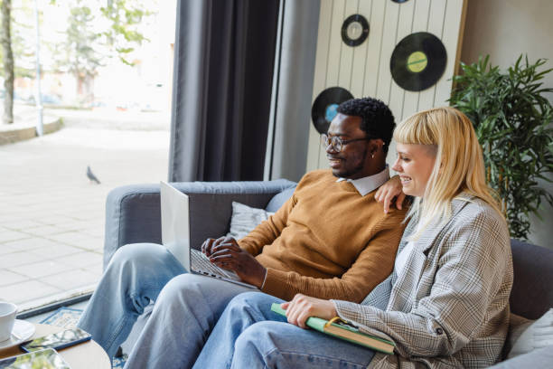 istock Cheerful diverse young coworkers chatting in modern co-working space 2137476740