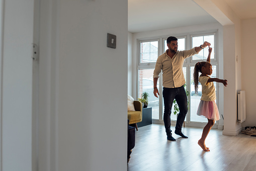 Full length view of a mid adult step father and his young step daughter dancing and having fun in a home interior in North Eastern England.

Videos are also available for this scenario.