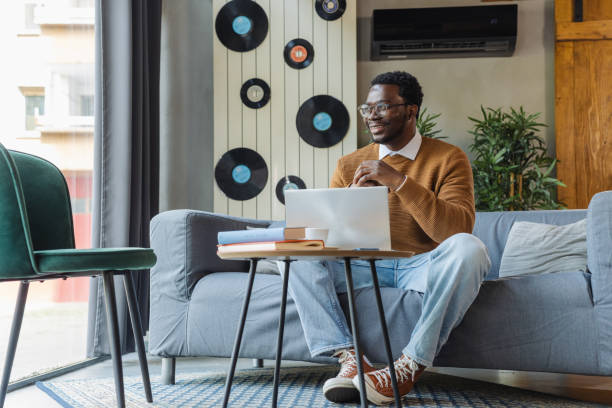 istock African American young freelancer working in modern co-working space 2137490909