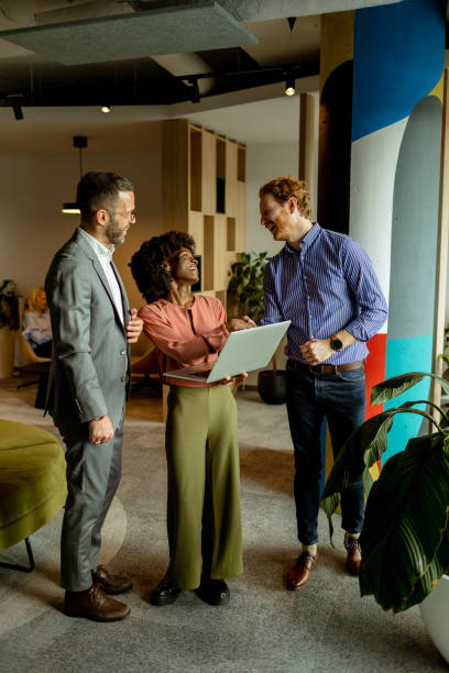 istock Creative team engaging in a lively brainstorming session at a colorful office space 2137491708