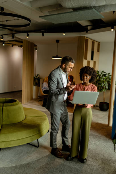 istock Modern office collaboration, two professionals engage in a creative brainstorming session 2137491746
