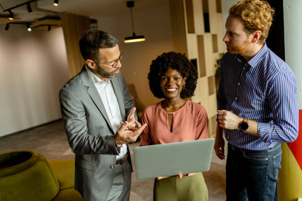 istock Creative team engaging in a lively brainstorming session at a colorful office space 2137491964