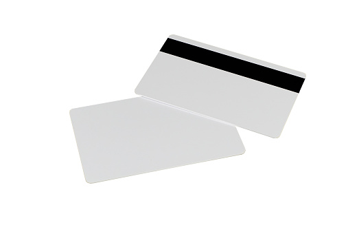 Man wearing a suit and tie and holding a blank business card while being isolated on a white background 
