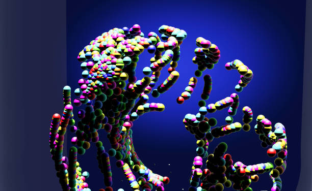 istock A donut-shaped object made up of colorful particles inside a test tube deforms and collapses. 2137537149
