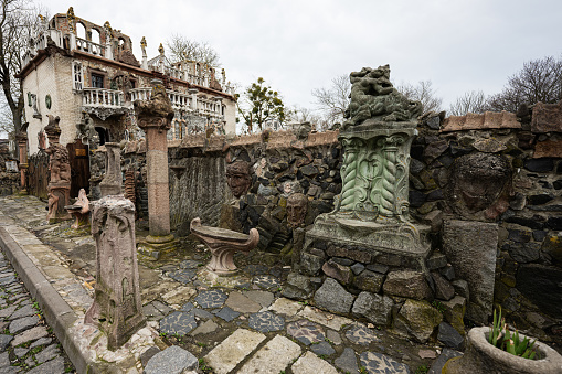 Lutsk, Ukraine - March, 2024:  House of thousand faces by sculptor Golovan. Ornate and eclectic stone mansion resembling a fairy tale castle with artistic details and sculptures.