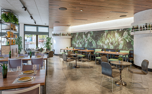 Large modern restaurant / bar with tables and chairs, stools, benches, breakfast cupboard and large windows with cityscape view in the background