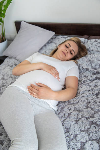 istock Pregnant woman has stomach ache. Selective focus. 2137598456