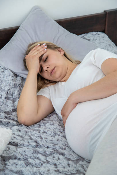 istock Pregnant woman has a headache. Selective focus. 2137598476