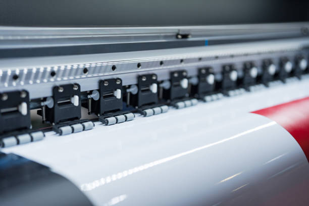 istock Close-up of large format printer heads in action 2137600604