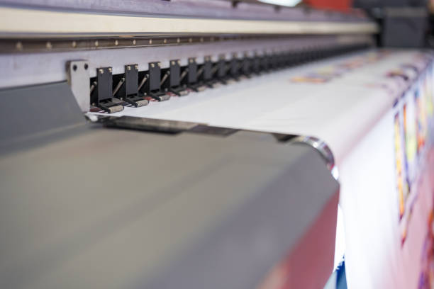 istock Close-up of large format printer heads in action 2137600606