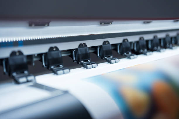 istock Close-up of large format printer heads in action 2137600617