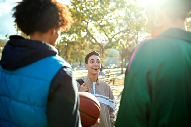 istock Young friends talking after basketball 2137604759