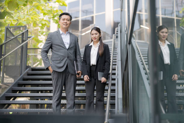 istock Professional business team on corporate stairway 2137611673