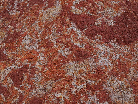 Colorful soil in various shades of orange.