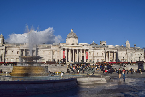 London, UK. November 28 2023. Exterior daytime view of the National Gallery and fountains in Trafalgar Square