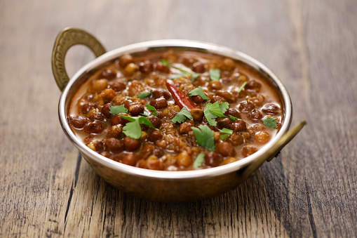 Kala chana masala, Indian-style black chickpea curry. vegetarian food.