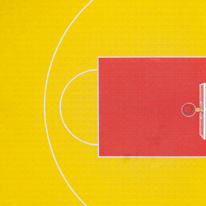 High angle view of red and yellow 3x3 basketball court.