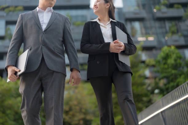 istock Business professionals walking in modern urban setting 2137653079