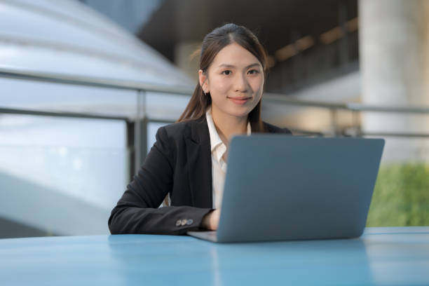 istock Professional woman working outdoors on laptop 2137653321