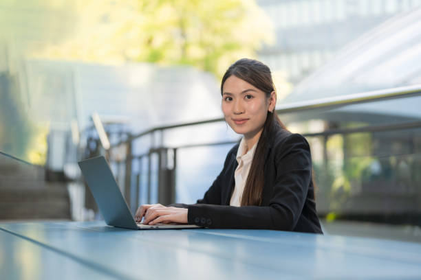 istock Professional woman working outdoors on laptop 2137653684