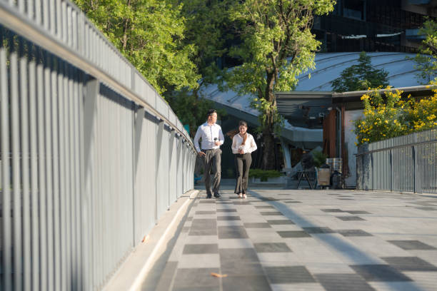 istock Business colleagues walking in urban setting 2137656810