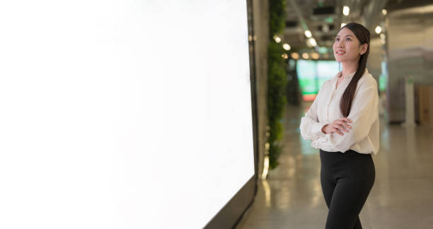 istock Confident businesswoman smiling in modern office space 2137656814