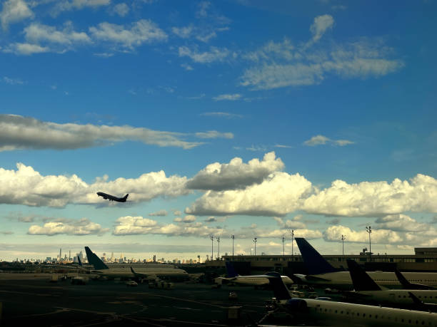 istock Airport runway with airplanes over Manhattan skyline 2137682495