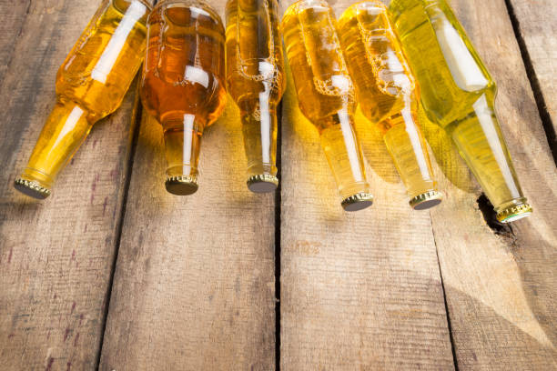 istock Beer bottles on a wooden table . 2137684096