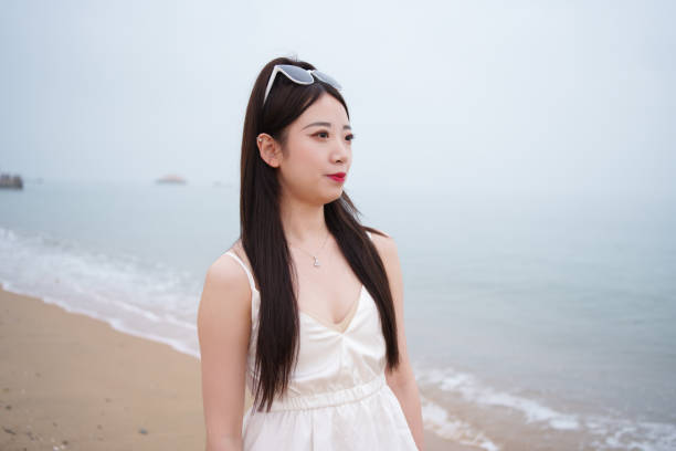 Asian female tourist at the beach