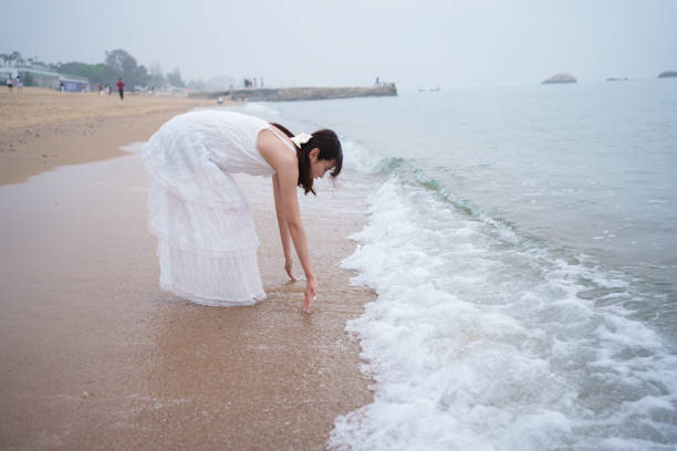 Young tourists playing at the beach