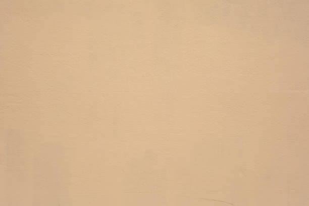 istock Part of a plain beige concrete wall 2137726927
