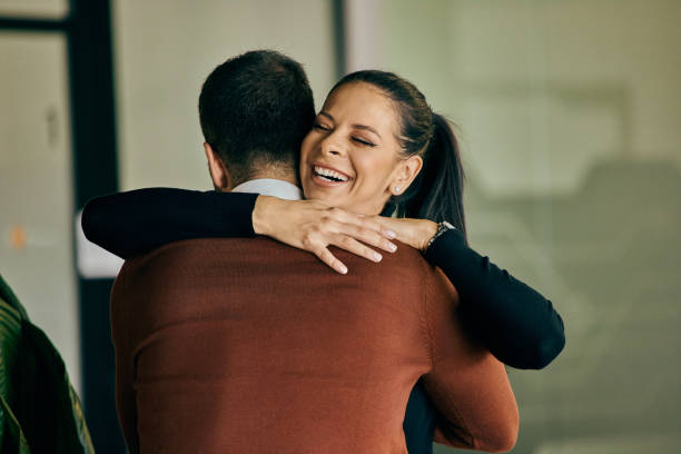 istock Business partners hugging each other after a successful project, at work. 2137761831