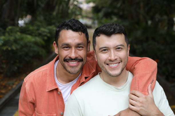 istock Hispanic gay couple posing with pride 2137800118