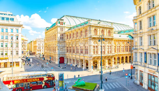 The Opera House in Vienna in the evening right after sunset with the typical Vienna Fiaker (Horse coach) in front. Nikon D3X. Converted from RAW.