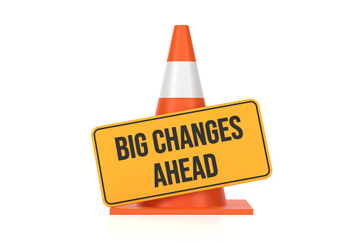 Traffic Cone And Big Changes Ahead Sign On White Background