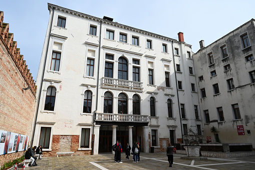 Venice, Italy, march 12, 2024 : Courtyard of Ca' Foscari University in Venice with students