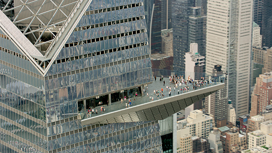 New York / U.S. - July 14, 2023: Aerial view of tourist people standing on balcony of Hudson Yards building in New York City, New York State, USA.